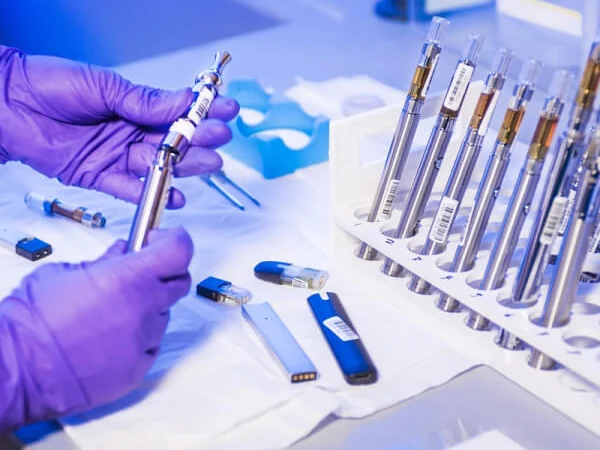 Hand holding laboratory tools