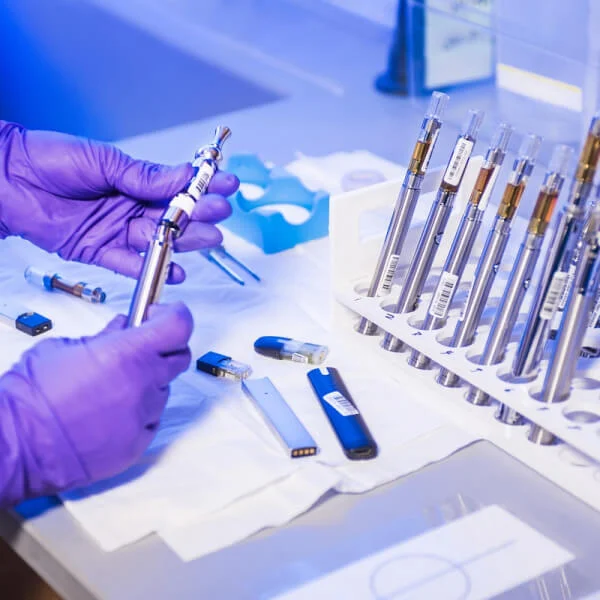 Hand holding laboratory tools